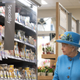 Queen Elizabeth II looks at products on the shelves at a Waitrose supermarket during a visit to the town of Poundbury on October 27, 2016 in Poundbury, Dorset. Photo via Getty Images.